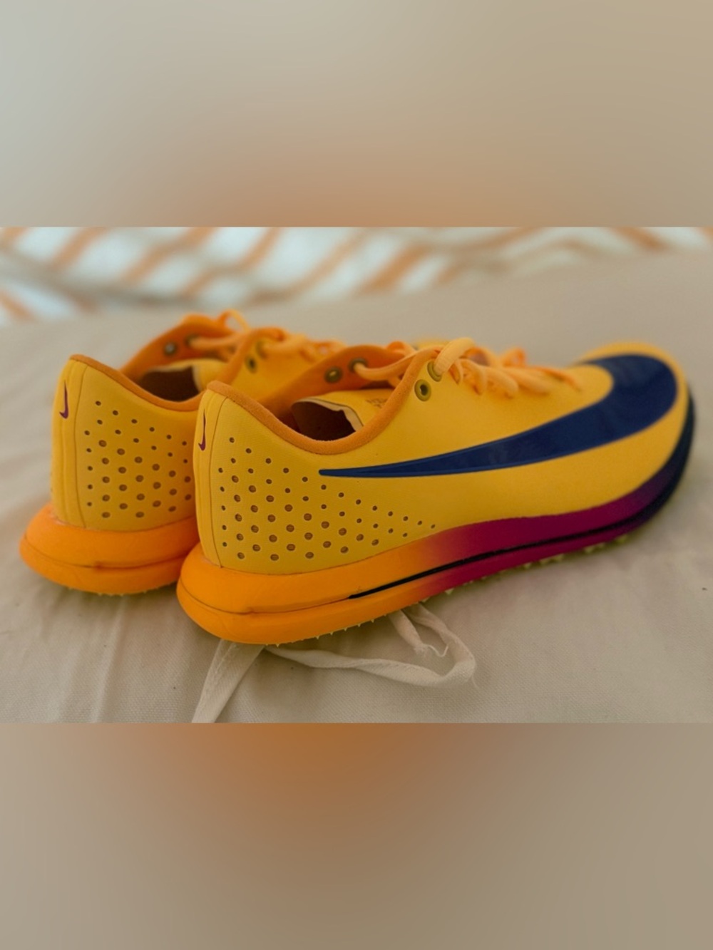 Nike Zoom TJ Elite 3 Spikes in Orange with Blue Swoosh and Pink Accent